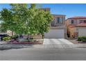 Charming two-story home featuring an attached two-car garage and a well-maintained front yard at 9065 W Torino Ave, Las Vegas, NV 89148