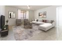 Sunlit living room showcasing a neutral sectional sofa, coordinating chairs, and modern artwork over a stylish area rug at 10742 Cowlite Ave, Las Vegas, NV 89166