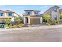 Charming two-story home features a tile roof, two-car garage, and landscaped front yard in a desirable neighborhood at 10851 Hanwicke Harbor Ave, Las Vegas, NV 89166