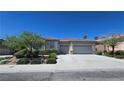 Attractive single-story home with a two-car garage and well-maintained landscaping at 11621 La Mirago Pl, Las Vegas, NV 89138