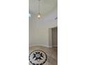 Elegant foyer featuring a decorative tile medallion and tall ceilings at 11621 La Mirago Pl, Las Vegas, NV 89138