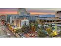 An eye-level cityscape view, showcasing hotels, palm trees and an impressive mountain range at 150 N Las Vegas Blvd # 804, Las Vegas, NV 89101
