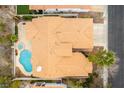 Birds-eye view of the home highlighting the pool, spa, tile roof, and lot layout at 1933 Davina St, Henderson, NV 89074