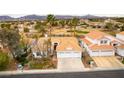 Expansive aerial view showcasing the home's proximity to the golf course and surrounding neighborhood at 1933 Davina St, Henderson, NV 89074