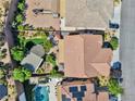 A bird's-eye view of a home showcasing the backyard, patio area, and roof at 2189 De Narvik Dr, Henderson, NV 89044