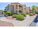 Attractive apartment building with well-maintained landscaping and walkways at 2300 E Silverado Ranch Blvd # 1165, Las Vegas, NV 89183