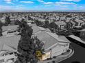 Overhead view of an apartment complex highlighting the city skyline in the distance, under a blue sky with white clouds at 350 S Durango Dr # 108, Las Vegas, NV 89145