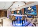 Modern kitchen with an island, stainless steel appliances, pendant lighting, and chic counter seating at 360 E Desert Inn Rd # 1901, Las Vegas, NV 89109