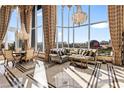 Bright and airy living space featuring large windows, elegant furnishings, and a stunning city view at 360 E Desert Inn Rd # 1901, Las Vegas, NV 89109