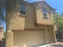 Home featuring an attached two-car garage and neutral color scheme at 4554 Townwall St, Las Vegas, NV 89115