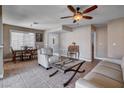 Bright living room featuring tile floors, a ceiling fan, and comfortable seating at 4860 Nara Vista Way # 204, Las Vegas, NV 89103