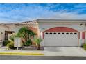 Charming single-story home featuring a two-car garage, landscaped front yard and desert landscaping at 5171 Briar Patch Way, Las Vegas, NV 89118