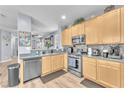 Well-equipped kitchen featuring stainless steel appliances and lots of counter space at 7115 Hickory Post Ave, Las Vegas, NV 89179