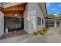 The front entrance has a custom door and stone accents that adds curb appeal to this home at 7140 Palmyra Ave, Las Vegas, NV 89117