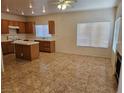 Open-concept living area features tile floors, fireplace, and ample natural light at 7849 Blue Brook Dr, Las Vegas, NV 89147