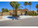 Beautiful single-story home with a three-car garage and mature landscaping, adding curb appeal at 8078 Leather Harness St, Las Vegas, NV 89131