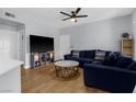 Cozy living room featuring sleek wood floors, modern decor, and plenty of natural light at 8501 W University Ave # 1002, Las Vegas, NV 89147