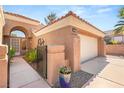 Beautiful home exterior showcasing desert landscaping and a stucco wall at 9445 January Dr, Las Vegas, NV 89134