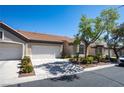 Charming single-story home features a well-manicured yard, mature trees and a two car garage at 9710 Geiger Peak Ct, Las Vegas, NV 89148