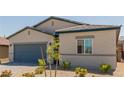 Single-story home featuring desert landscaping, gray accents, and a two-car garage at 10257 Sequoia Falls Pl, Las Vegas, NV 89149