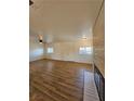 Bright, open living room with wood flooring, fireplace, and abundant natural light at 131 Copper St, Henderson, NV 89015