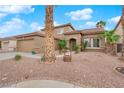 Lovely single-Gathering home with a two-car garage and desert landscaping at 1893 Donnington Ct, Las Vegas, NV 89123