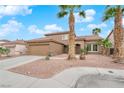 Beautiful home featuring a two-car garage, desert landscaping, and a tile roof at 1893 Donnington Ct, Las Vegas, NV 89123