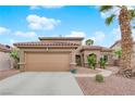 Lovely single-Gathering home with a two-car garage and desert landscaping at 1893 Donnington Ct, Las Vegas, NV 89123