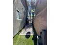 Cozy side yard featuring stone pathway, small water feature, and artificial turf at 2229 Steele St, Las Vegas, NV 89156