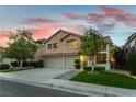 Attractive two-story home with a well-kept lawn and mature trees enhancing curb appeal at 2232 Le Conte Ave, Henderson, NV 89074