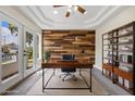 Bright office space with wood paneling, French doors, and custom built-ins at 2647 Hourglass Dr, Henderson, NV 89052