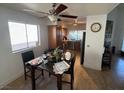 Charming kitchen and dining area with dark wood cabinets, stainless steel appliances, and a cozy breakfast nook at 2989 Bel Air Dr, Las Vegas, NV 89109