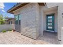 Close-up of home's modern front door and stone accents at 313 Forsyth Park St, Las Vegas, NV 89138