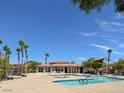 Resort-style community pool and lounge area with ample seating and palm trees at 3638 Via Messina, Henderson, NV 89052