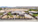 Stately single-story home boasts manicured landscaping, mature trees, and a secure gated entrance for added privacy at 3955 W Jo Rae Ave, Las Vegas, NV 89141