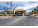 Gated community entrance featuring a horse statue, offering security and a touch of elegance at 4037 Vulcan St, Las Vegas, NV 89122