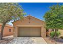 Charming single-story home with a two-car garage, a well-maintained yard, and desert landscaping at 4037 Vulcan St, Las Vegas, NV 89122