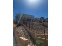 Backyard view showing terraced landscaping, a staircase, and a partial view of the house at 44 Moon Hill Dr, Henderson, NV 89011