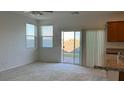 Bright living area with large windows and sliding glass doors to the outdoor patio at 4752 Cactus Sun Ln, North Las Vegas, NV 89031