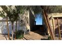 A narrow side yard features desert landscaping and a walkway between houses at 4752 Cactus Sun Ln, North Las Vegas, NV 89031