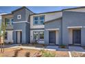 Two-story townhouses with inviting entrances, enhancing curb appeal in a desert landscape at 5020 Fern Mesa Ave # Lot 139, Las Vegas, NV 89139