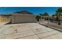 Spacious driveway leading to a single-story home with an attached garage at 5170 S Pearl St, Las Vegas, NV 89120