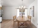Cozy dining area featuring an oval table with seating for six and a modern chandelier at 6121 Iris Cir, Las Vegas, NV 89107