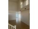 Open-concept living area with tile floors, large windows, and an airy atmosphere at 7228 Chic Ave, Las Vegas, NV 89129