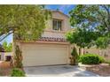 Lovely two-story home with a two-car garage, tile roof, and mature trees providing shade and curb appeal at 7924 Horn Tail Ct, Las Vegas, NV 89131