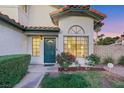 Close-up of home entry featuring decorative plants and a tiled roof at 8388 Brad Oaks Cir, Las Vegas, NV 89123