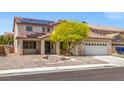Two-story home features a neutral color scheme, large garage, and solar panels at 8723 Melissa Meadows St, Las Vegas, NV 89131