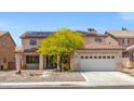 Two-story home features a neutral color scheme, large garage, and solar panels at 8723 Melissa Meadows St, Las Vegas, NV 89131