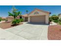 Charming single-story home featuring a desert landscape and a two-car garage at 8921 Signal Terrace Dr, Las Vegas, NV 89134