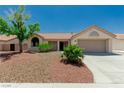 Charming single-story home featuring a desert landscape and a two-car garage at 8921 Signal Terrace Dr, Las Vegas, NV 89134